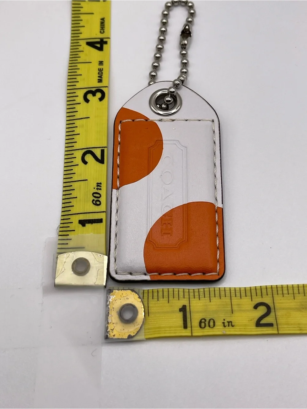 Coach XL White with Orange Dots Leather Hang Tag with Metal Ball Chain
